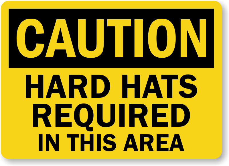 OSHA compliant yellow sign with black text saying 'CAUTION HARD HATS REQUIRED IN THIS AREA'